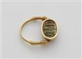 An 18k gold twisting ring with an ancient Egyptian scarab amulet - image-2