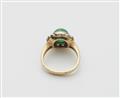 A German 18k gold emerald cabochon and diamond cluster ring - image-2