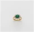 A German 18k gold emerald cabochon and diamond cluster ring - image-1