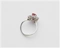 An 18k white gold diamond and ruby cluster ring. - image-2