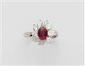 An 18k white gold diamond and ruby cluster ring. - image-1