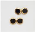 A pair of French 18k gold and onyx cufflinks. - image-1