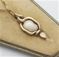 A German 18k gold sapphire, tsavorite and diamond Art Nouveau snake pendant with a large baroque Oriental pearl. - image-3