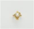 An 18k gold and cultured pearl ring. - image-1