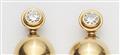 A pair of German 18k yellow gold and diamond solitaire clip earrings. - image-2