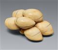 An ivory netsuke of a group of gingko nuts. Early 19th century - image-1