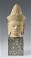 A Cambodian sandstone head of a deity. - image-1