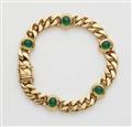 An 18k gold chain bracelet with cabochon-cut emeralds. - image-1