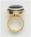 An 18k gold and eye agate cabochon ring. - image-2