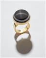 An 18k gold and eye agate cabochon ring. - image-1