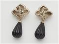 A pair of sterling silver, 18k gold and onyx "Ivy Starfish" clip earrings. - image-2