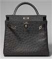 A black ostrich leather Hermès Kelly bag 28 with silver palladium hardware. - image-2