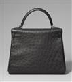 A black ostrich leather Hermès Kelly bag 28 with silver palladium hardware. - image-4
