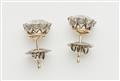 A pair of 14k gold and transition-cut diamond solitaire stud earrings. - image-3