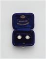 A pair of 14k gold and transition-cut diamond solitaire stud earrings. - image-1