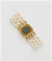 A woven cultured pearl bracelet with an 18k gold and black opal clasp. - image-1