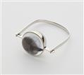 A German 18k white gold kinetic bangle with a moving ball in a spherical gold and rock crystal capsule. - image-1