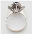 An 18k white gold diamond and sapphire cluster ring. - image-2