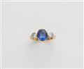 A German 18k gold diamond and natural sapphire three stone ring. - image-2