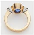 A German 18k gold diamond and natural sapphire three stone ring. - image-3