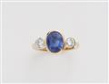 A German 18k gold diamond and natural sapphire three stone ring. - image-1