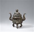 A large elephant tripod bronze incense burner and cover.
18th century or later - image-1