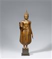An Ayutthaya-style bronze figure of a standing Buddha. 19th/20th century - image-1