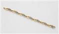 An Italian 18k bicolour gold curb link bracelet. - image-1