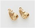 A pair of 18k "Fami" Cartier diamond clip earrings. - image-2
