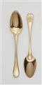 A pair of Strasbourg silver gilt serving spoons - image-1