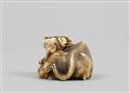 An ivory netsuke of a Chinese scholar sitting next to an ox. 19th century - image-4