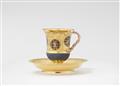 A Berlin KPM porcelain cup and saucer with putti behind bars - image-2