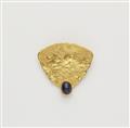 A German 18k gold and sapphire cabochon brooch. - image-1