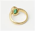 A German 18/21k gold and emerald cabochon ring with swiveling ring head. - image-2