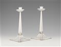 A pair of Arts and Crafts silver candlesticks - image-1