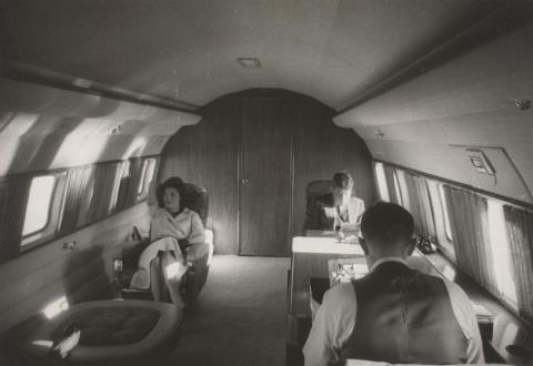 Jacques Lowe - John F. Kennedy and wife with Lyndon Johnson aboard Air Force One