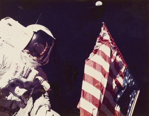 NASA - Harrison H. Schmitt next to the United States flag, Apollo 17