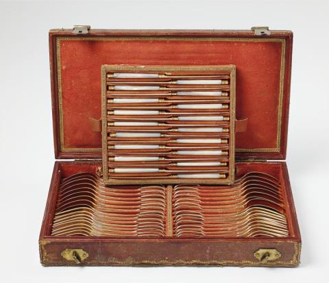 Francois Daniel Imlin - A set of Strasbourg silver gilt dessert cutlery. Comprising 18 each of knives, forks and spoons. Marks of Francois-Daniel Imlin, 1798 - 1809, the unmarked vermeil knives with mother-of-pearl handles.