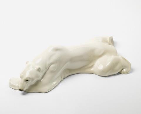 Anton Puchegger - A KPM figure of a reclining polar bear.