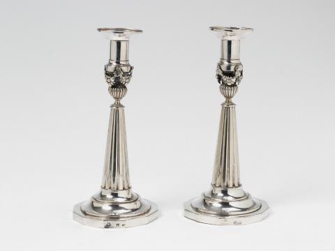 A pair of Berlin silver candlesticks.