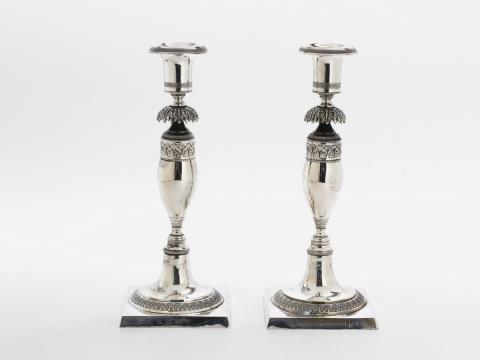 A pair of Berlin silver Biedermeier candlesticks, monogrammed "D.G".