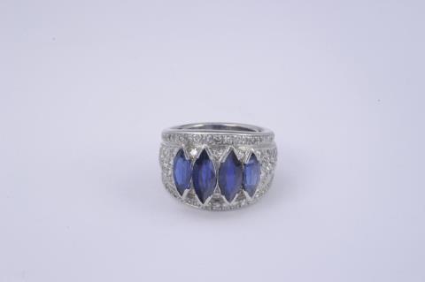 A platinum ring set with sapphires.