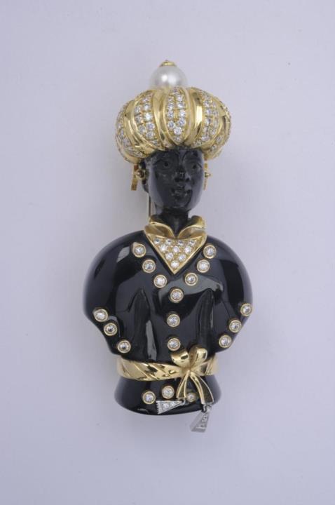 An 18k gold and onyx Venetian "moretto" clip brooch.