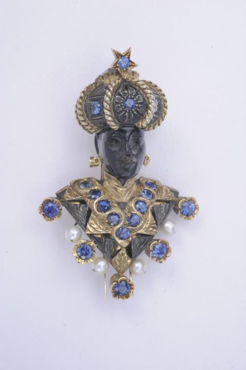 A "Paola" model 18k gold, silver and sapphire Venetian "moretto" clip brooch.