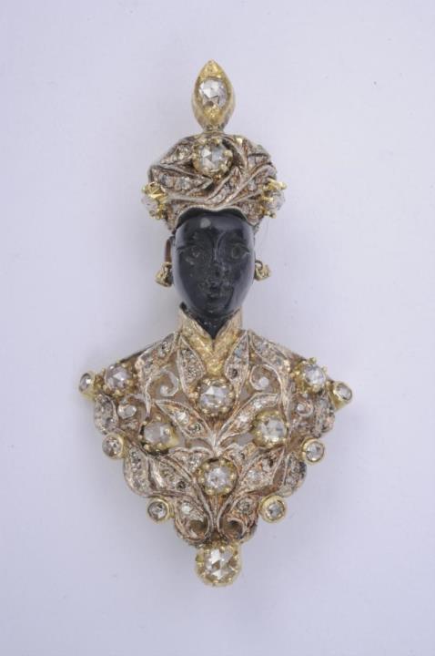 An 18k gold and diamond Venetian "moretto" clip brooch.