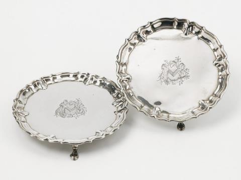 A pair of George II silver salvers. Engraved with a coat-of-arms. Marks of John Tuite, London 1737.