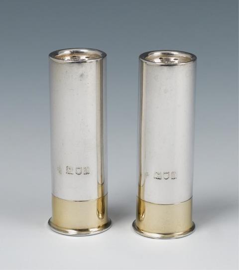 Horace Woodward & Co. - A pair of London silver partially gilt salt casters formed as shotgun cartridges. Marks of Horace Woodward & Co., 1902.