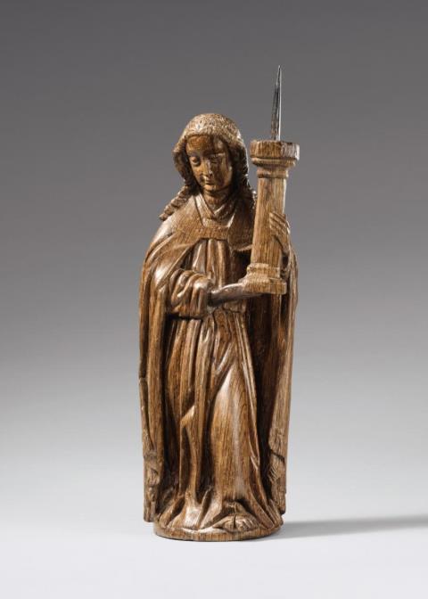  Lower Rhine Region - A Lower Rhenish oakwood figure of an angel with a candlestick, circa 1500/1510.