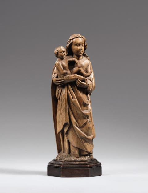  Lower Rhine Region - An early 16th century Lower Rhenish carved wooden figure of the Virgin with Child.