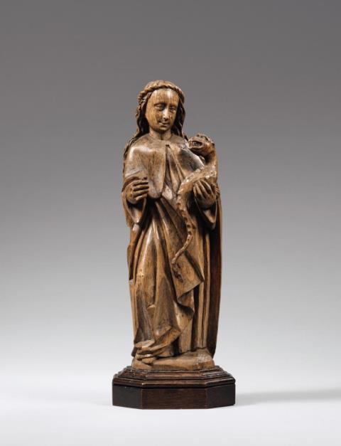  Lower Rhine Region - An early 16th century Lower Rhenish carved wooden figure of Saint Margaret.